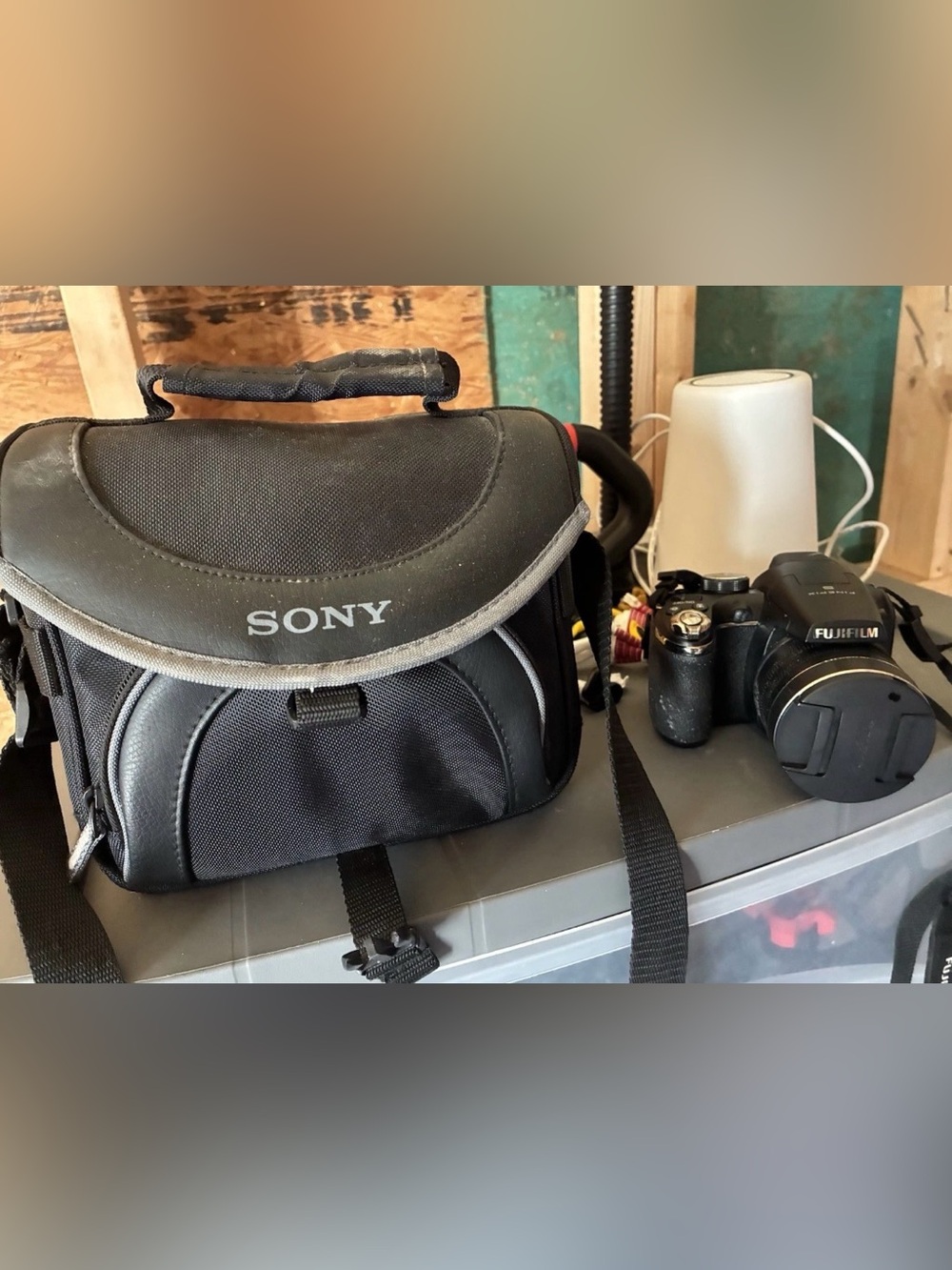 Fujifilm FinePix S-series digital camera with travel case